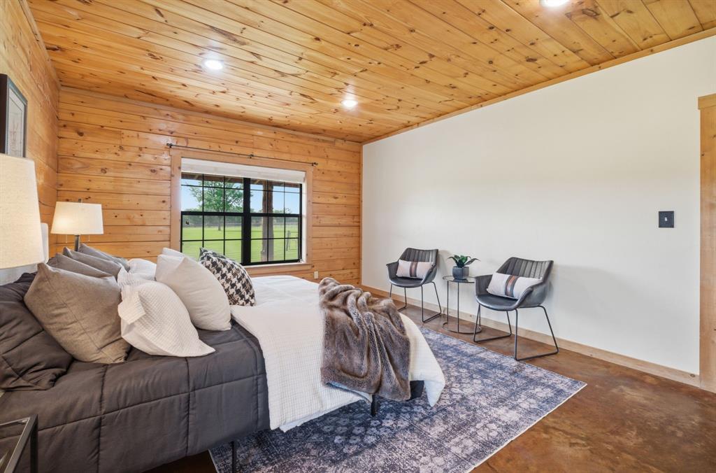 465 Emberson Ranch Road Pilot Point, TX 76258 - Photo 13 of 40 a bedroom with furniture and a window