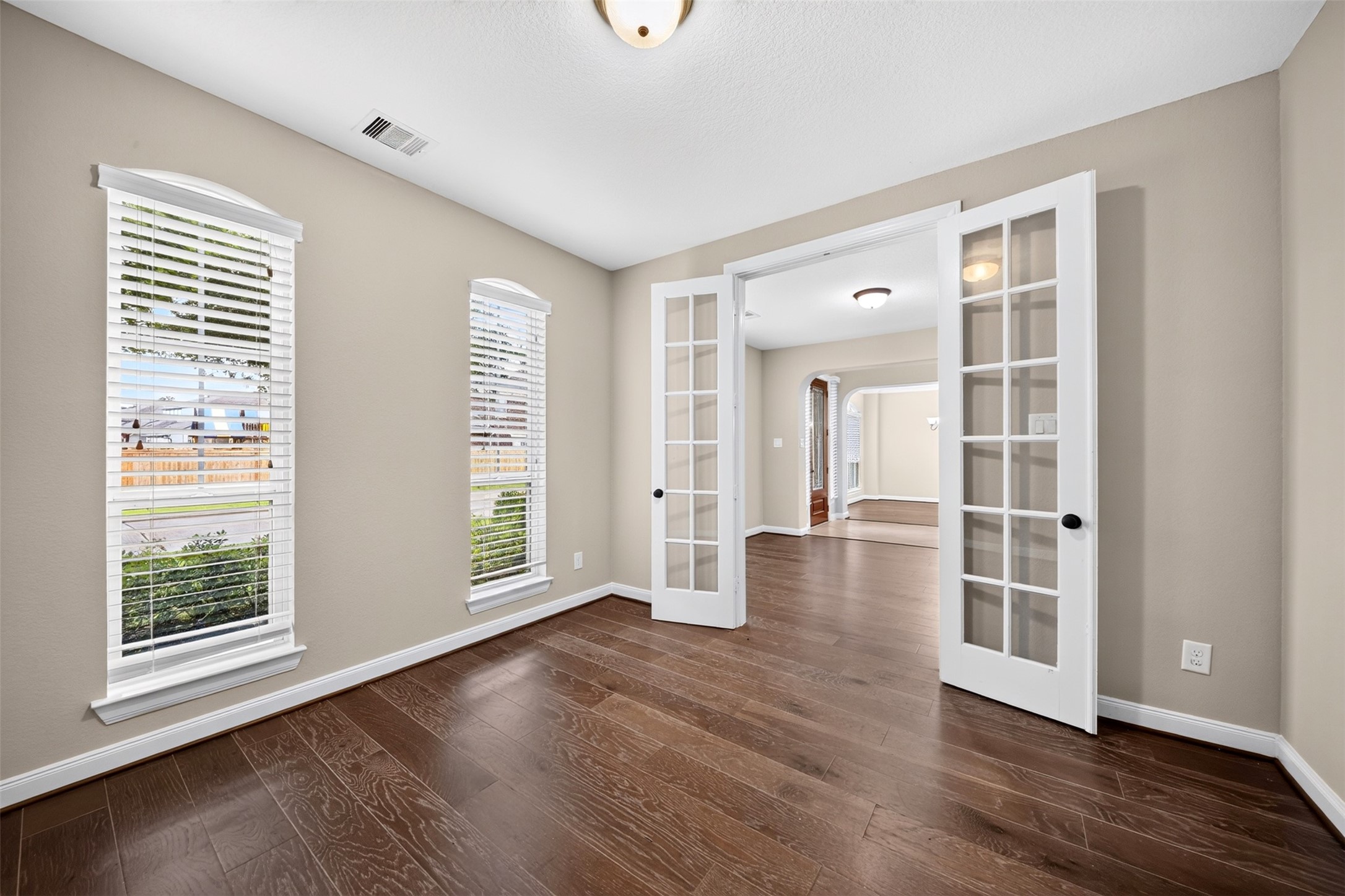 6234 Avon Landing Lane Spring, TX 77379 - Photo 11 of 49 Separated from the main living areas by double glass French doors, and being at the front of the home for convenience, this work from home / study is all the modern family needs.