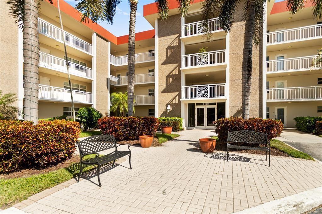 a view of a dinning tables and chairs in the patio of a house