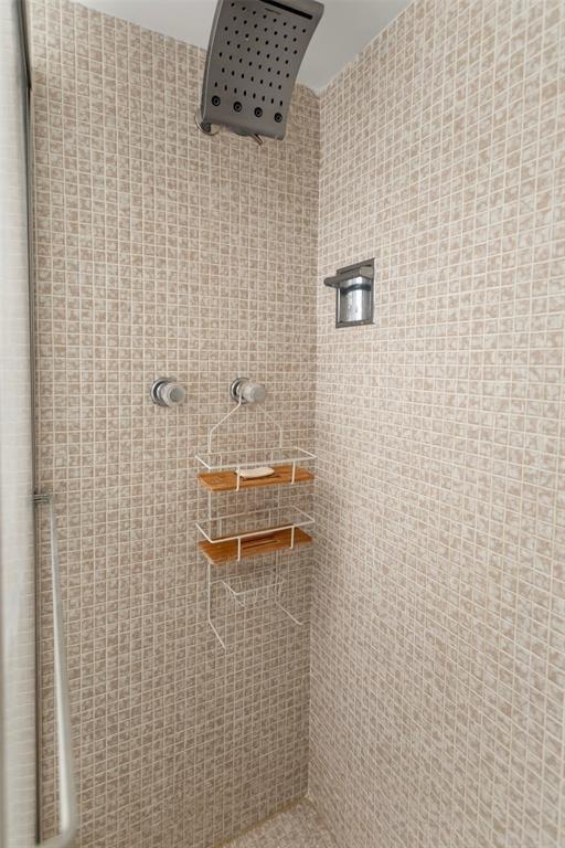 3100 Northeast 48th Court, Unit 413 Lighthouse Point, FL 33064 - Photo 20 of 32 a bathroom with a shower