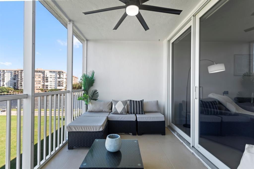 3100 Northeast 48th Court, Unit 413 Lighthouse Point, FL 33064 - Photo 21 of 32 a living room with furniture and a large window
