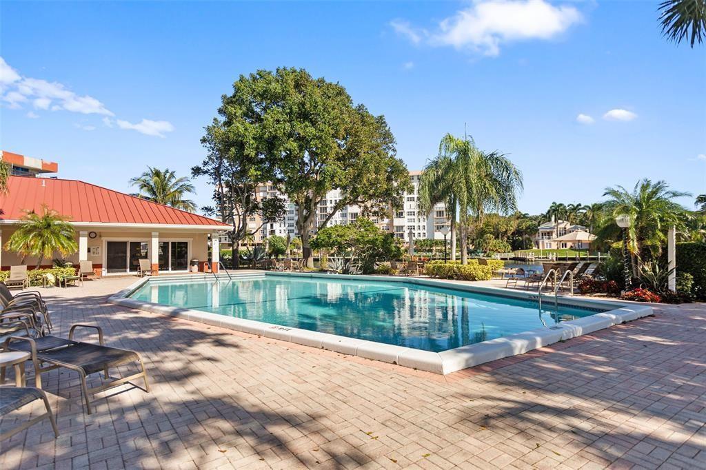 3100 Northeast 48th Court, Unit 413 Lighthouse Point, FL 33064 - Photo 24 of 32 a view of a house with a yard