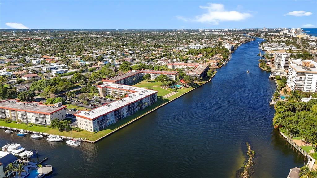 3100 Northeast 48th Court, Unit 413 Lighthouse Point, FL 33064 - Photo 30 of 32 an aerial view of residential houses with outdoor space