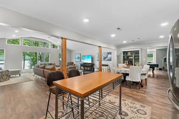 a view of a dining room with furniture window and wooden floor
