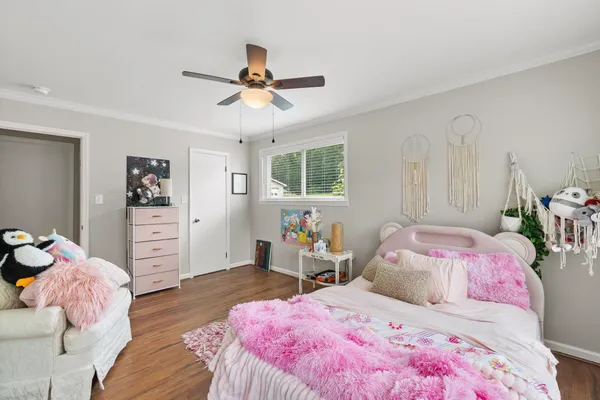 a bedroom with a bed and furniture