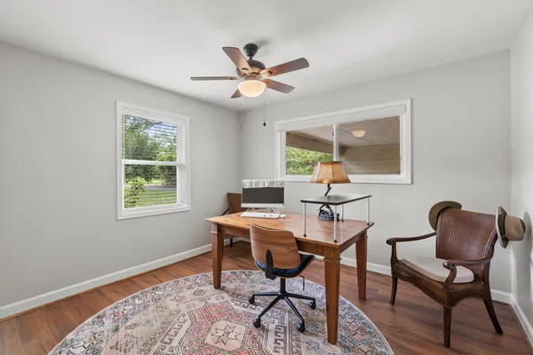 a workspace with furniture and window