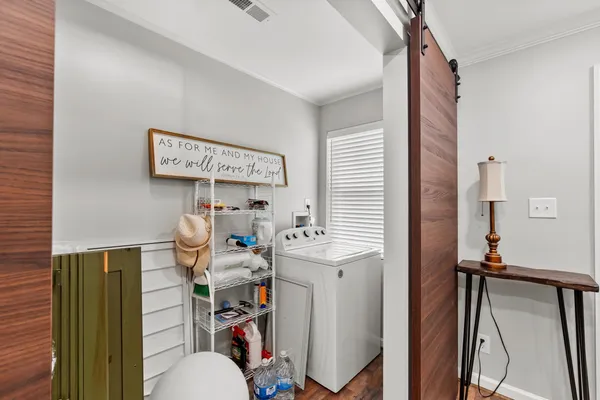 a view of a bathroom with a sink and a mirror
