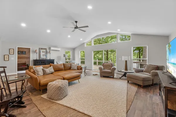a living room with furniture and a large window