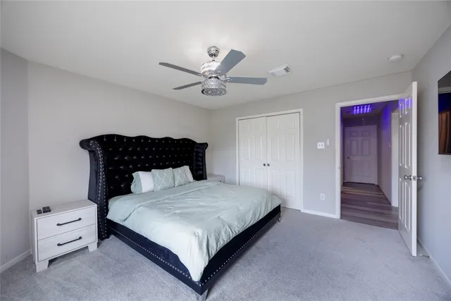 a living room with furniture a chandelier and a window