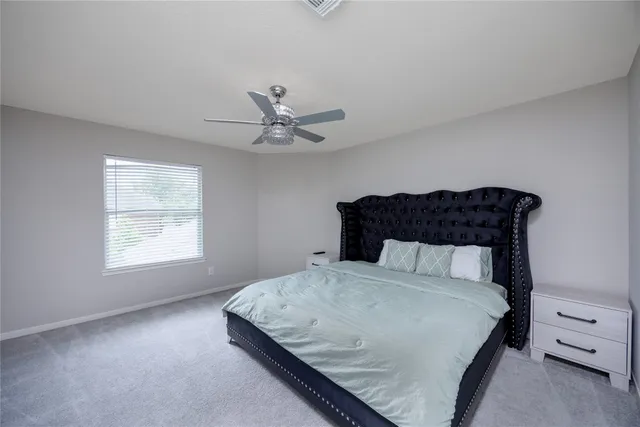 a bedroom with furniture and a window