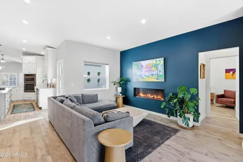 a room with furniture and a potted plant