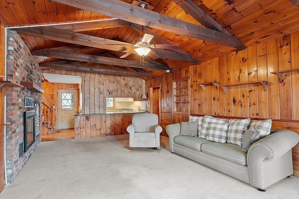 75 Conleys Grove Road Derry, NH 03038 - Photo 17 of 41 a outdoor living space with furniture and a fireplace