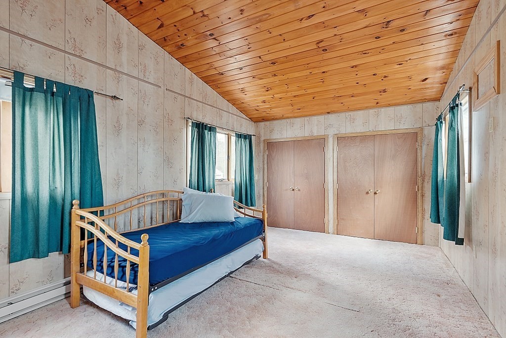 75 Conleys Grove Road Derry, NH 03038 - Photo 28 of 41 a spacious bedroom with a bed and a window