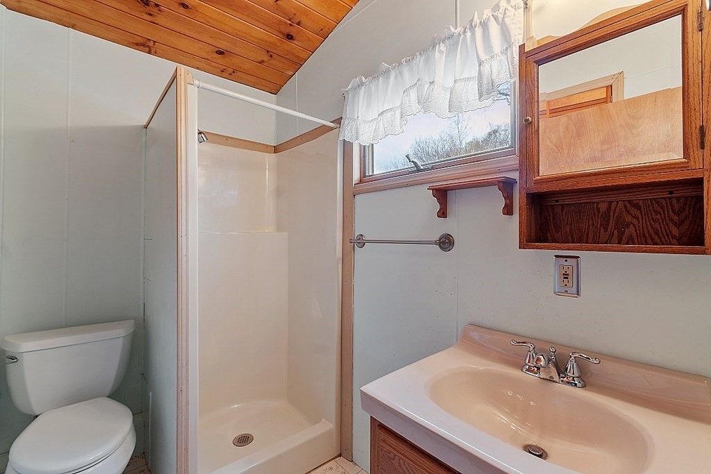 75 Conleys Grove Road Derry, NH 03038 - Photo 31 of 41 a bathroom with a sink toilet and shower