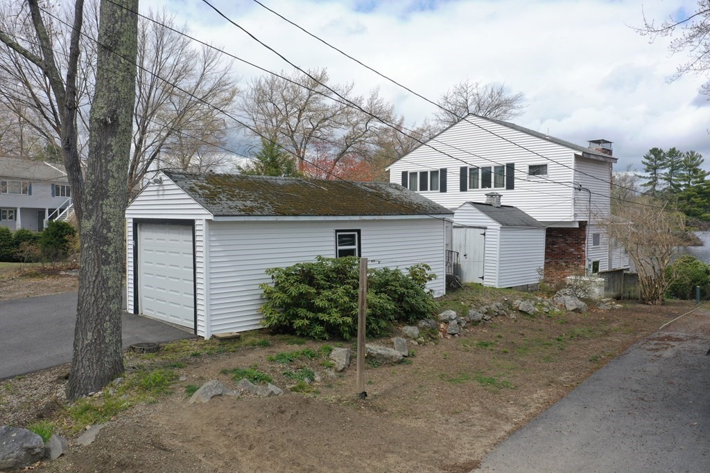 75 Conleys Grove Road Derry, NH 03038 - Photo 39 of 41 a front view of a house with garden