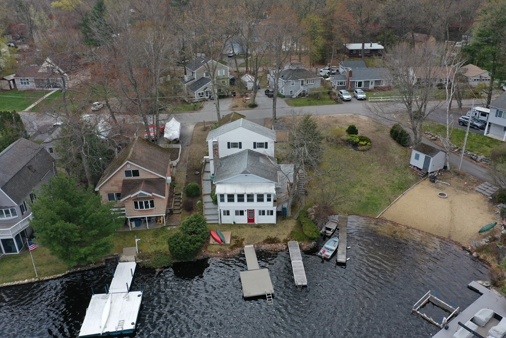 75 Conleys Grove Road Derry, NH 03038 - Photo 41 of 41 an aerial view of a house with a garden and signage