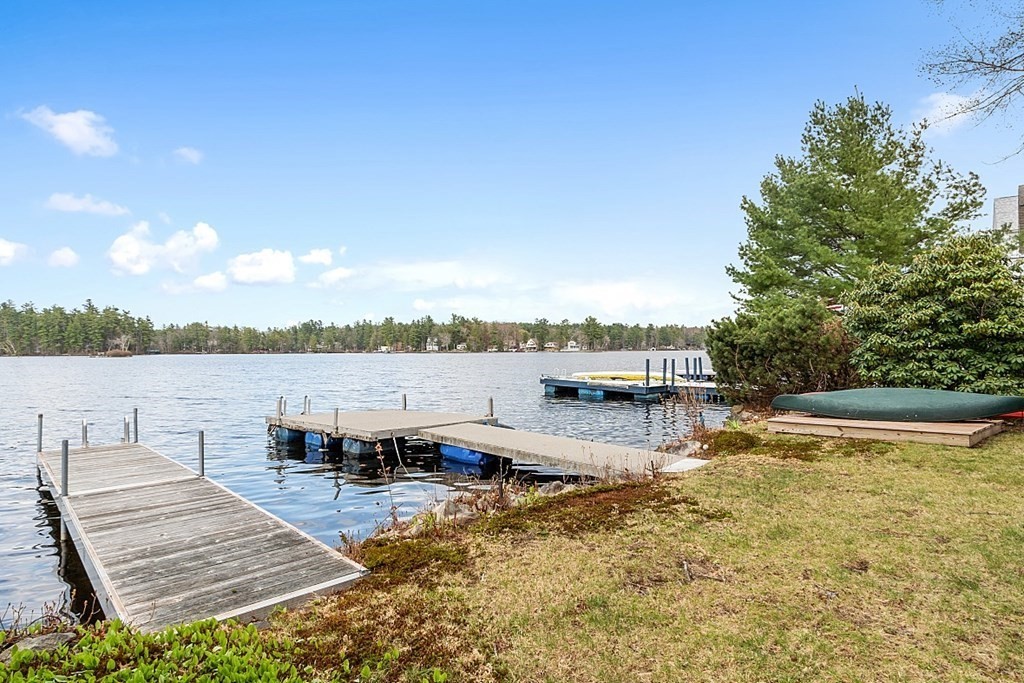 75 Conleys Grove Road Derry, NH 03038 - Photo 5 of 41 a view of a lake with chairs