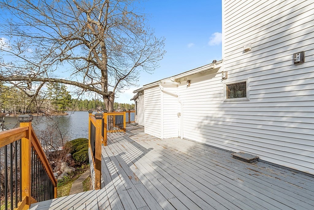 75 Conleys Grove Road Derry, NH 03038 - Photo 10 of 41 a view of deck with wooden floor and outdoor seating