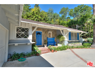 2139 Roscomare Road Los Angeles, CA 90077 - Photo 3 of 21 a front view of a house with garden
