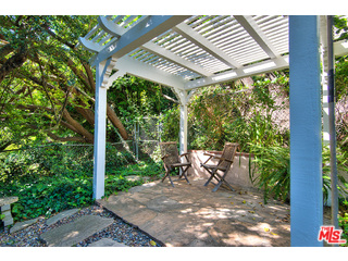 2139 Roscomare Road Los Angeles, CA 90077 - Photo 21 of 21 a view of a patio with table and chairs and potted plants