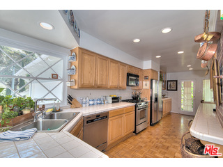 2139 Roscomare Road Los Angeles, CA 90077 - Photo 6 of 21 a kitchen filled a sink a counter top space and stainless steel appliances