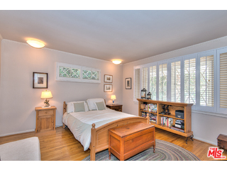 2139 Roscomare Road Los Angeles, CA 90077 - Photo 10 of 21 a bedroom with furniture and a large window