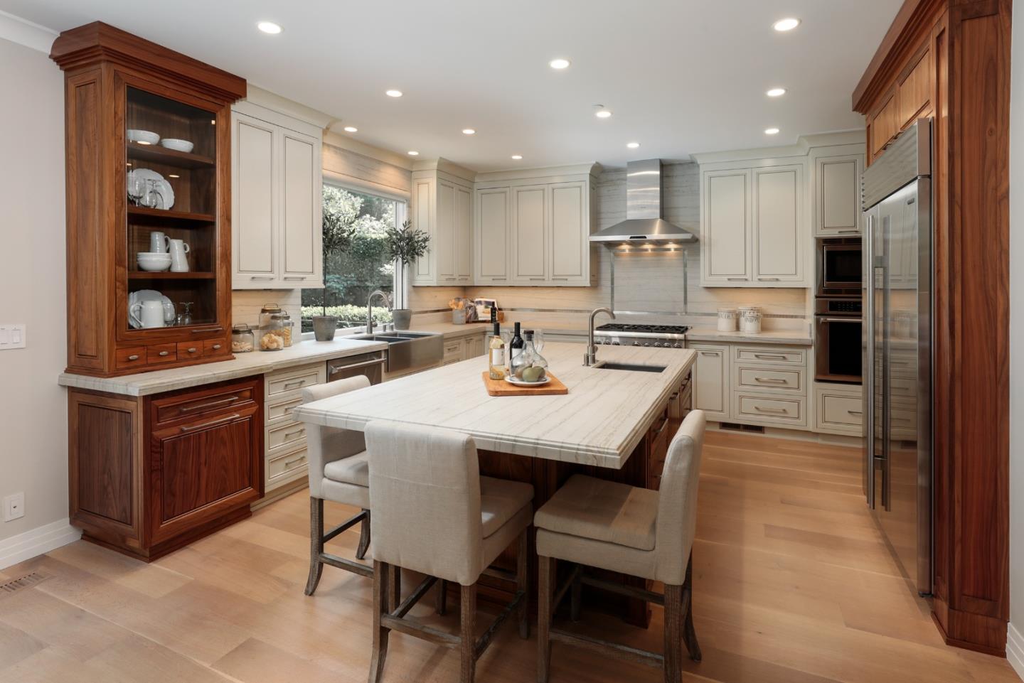 9 Park Drive Atherton, CA 94027 - Photo 11 of 56 a kitchen with a table chairs refrigerator and microwave