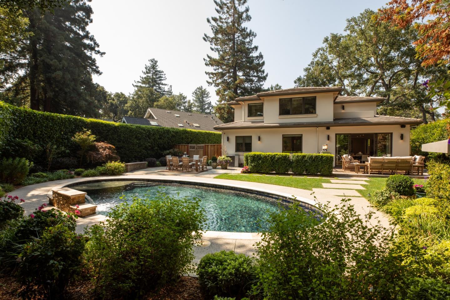 9 Park Drive Atherton, CA 94027 - Photo 45 of 56 a view of a swimming pool with a patio