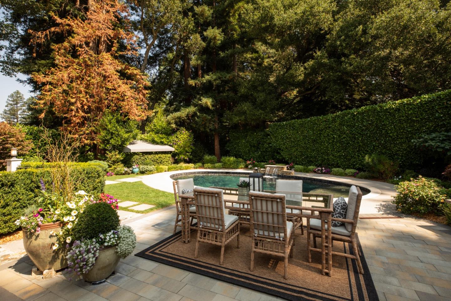 9 Park Drive Atherton, CA 94027 - Photo 46 of 56 a view of a patio with table and chairs with wooden floor and fence