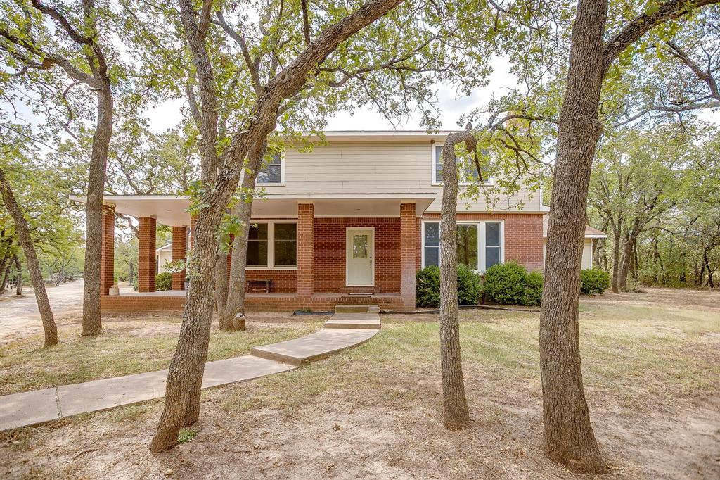 3500 Henderson Ranch Road Bridgeport, TX 76426 - Photo 3 of 40 a front view of a house with a tree in front
