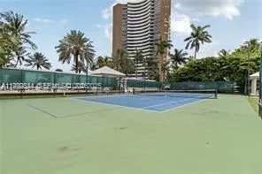 a front view of a house with swimming pool and patio