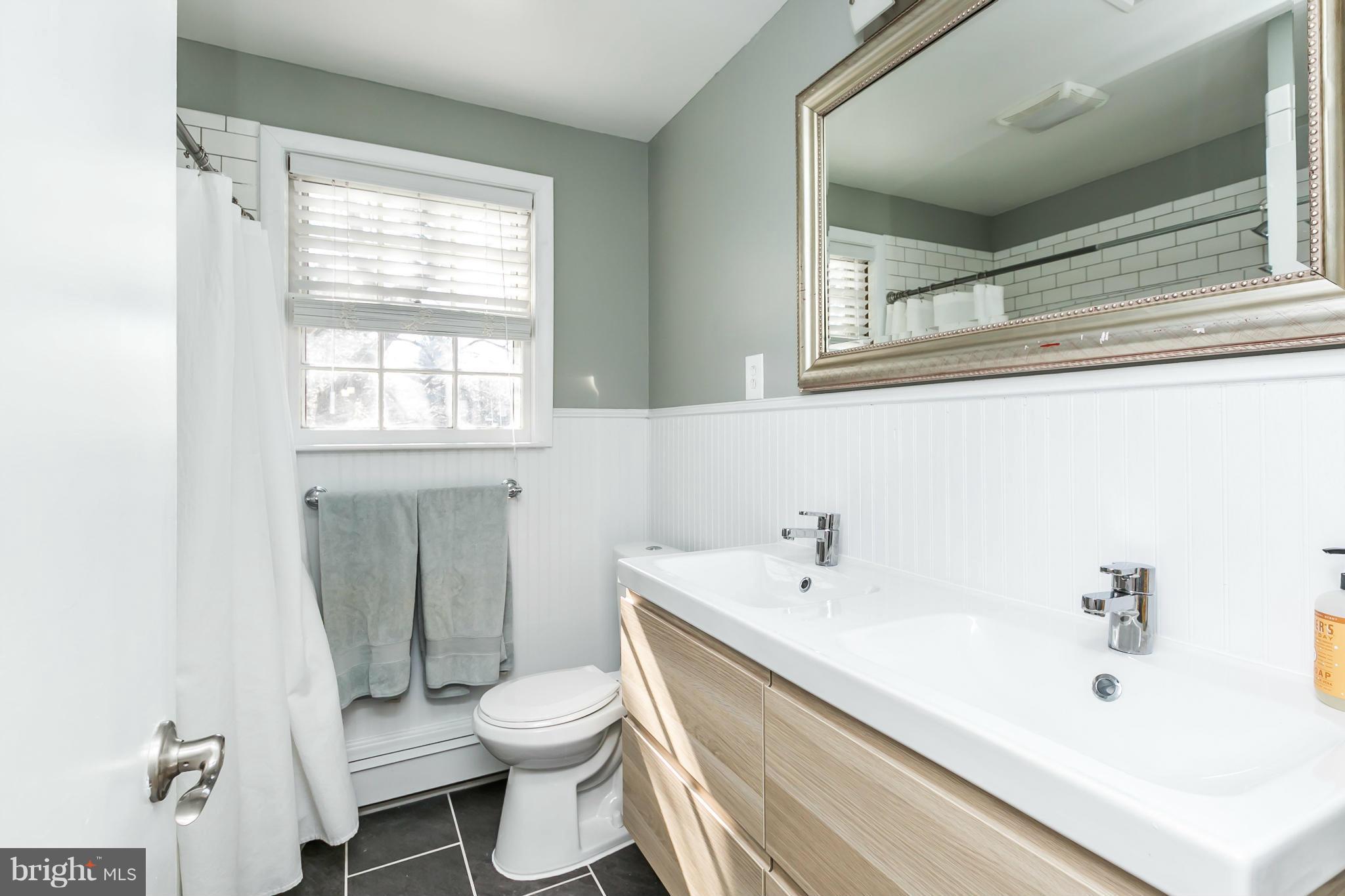 1 Beechdale Road Baltimore, MD 21210 - Photo 23 of 28 a bathroom with a sink toilet and tub