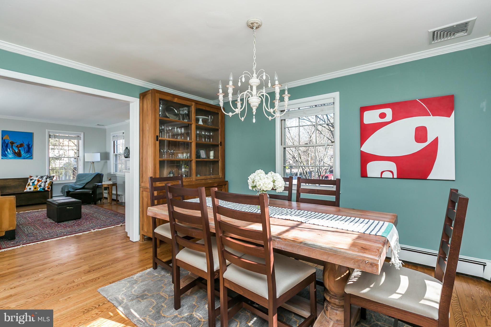 1 Beechdale Road Baltimore, MD 21210 - Photo 6 of 28 a view of a dining room with furniture wooden floor and chandelier