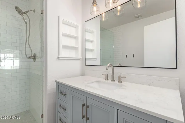 a bathroom with a sink and a mirror