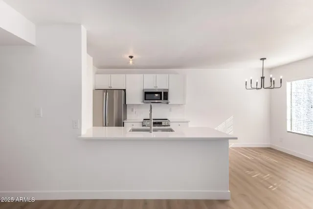 a view of kitchen with wooden floor