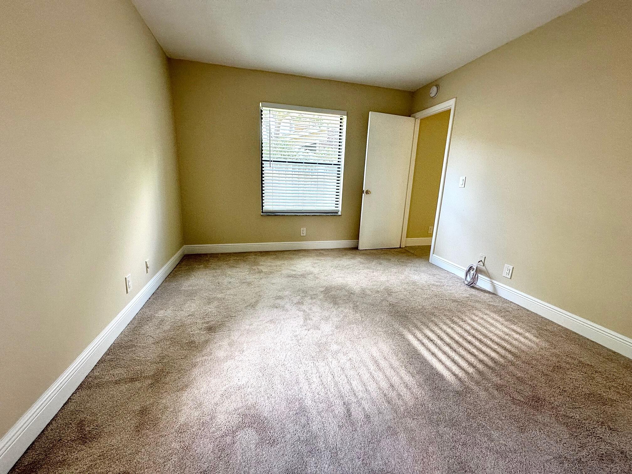 21904 Lake Forest Circle, Unit 101 Boca Raton, FL 33433 - Photo 6 of 11 Primary bedroom