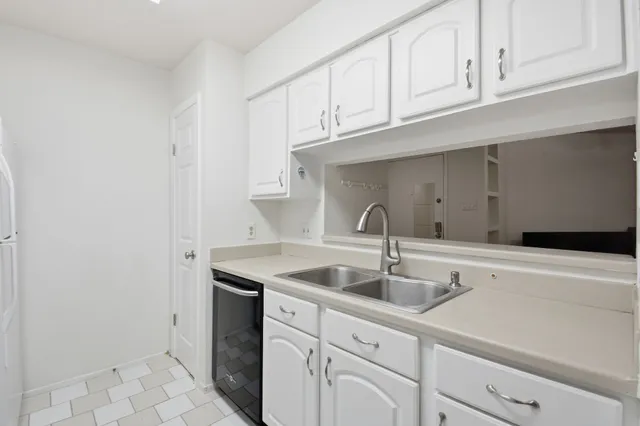 a kitchen with cabinets and a stove