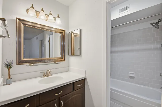 a bathroom with a toilet and shower