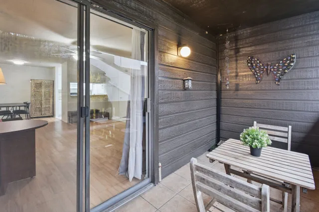 a view of a door and wooden floor