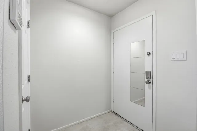 a bathroom with a glass shower door