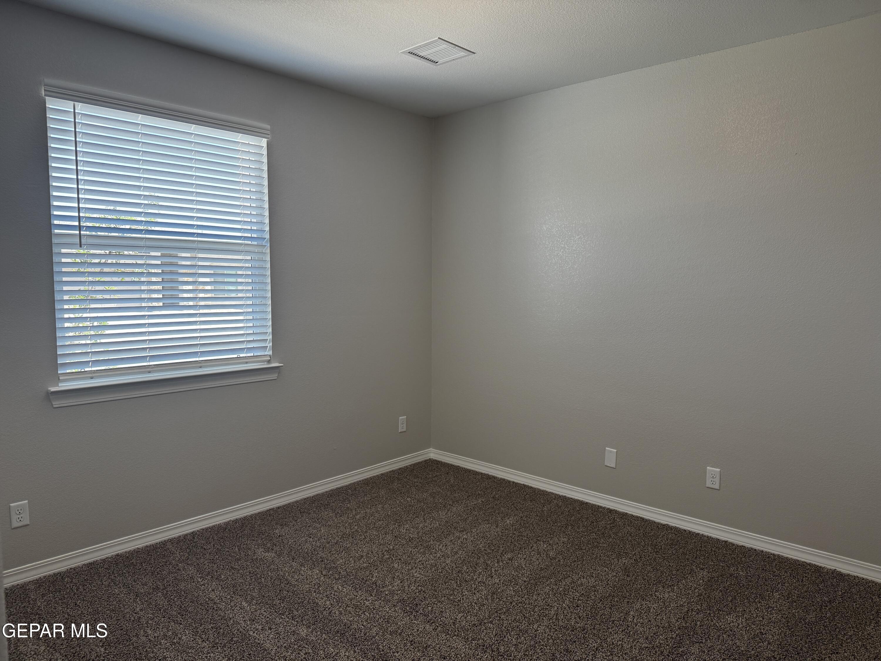 14434 Aria Lopez Drive El Paso, TX 79938 - Photo 12 of 37 an empty room with a window