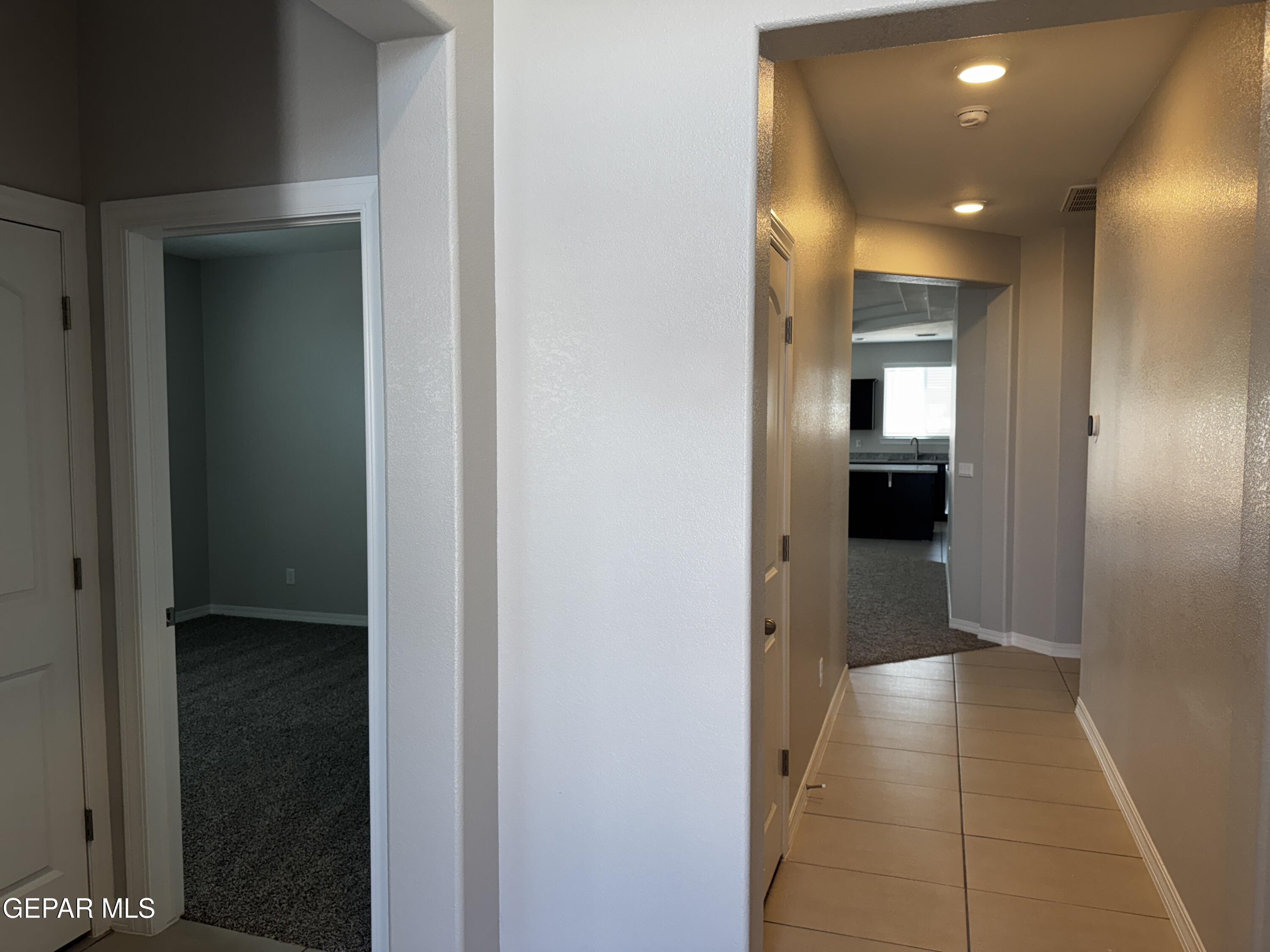 14434 Aria Lopez Drive El Paso, TX 79938 - Photo 14 of 37 a view of hallway with a bathroom and a bathroom