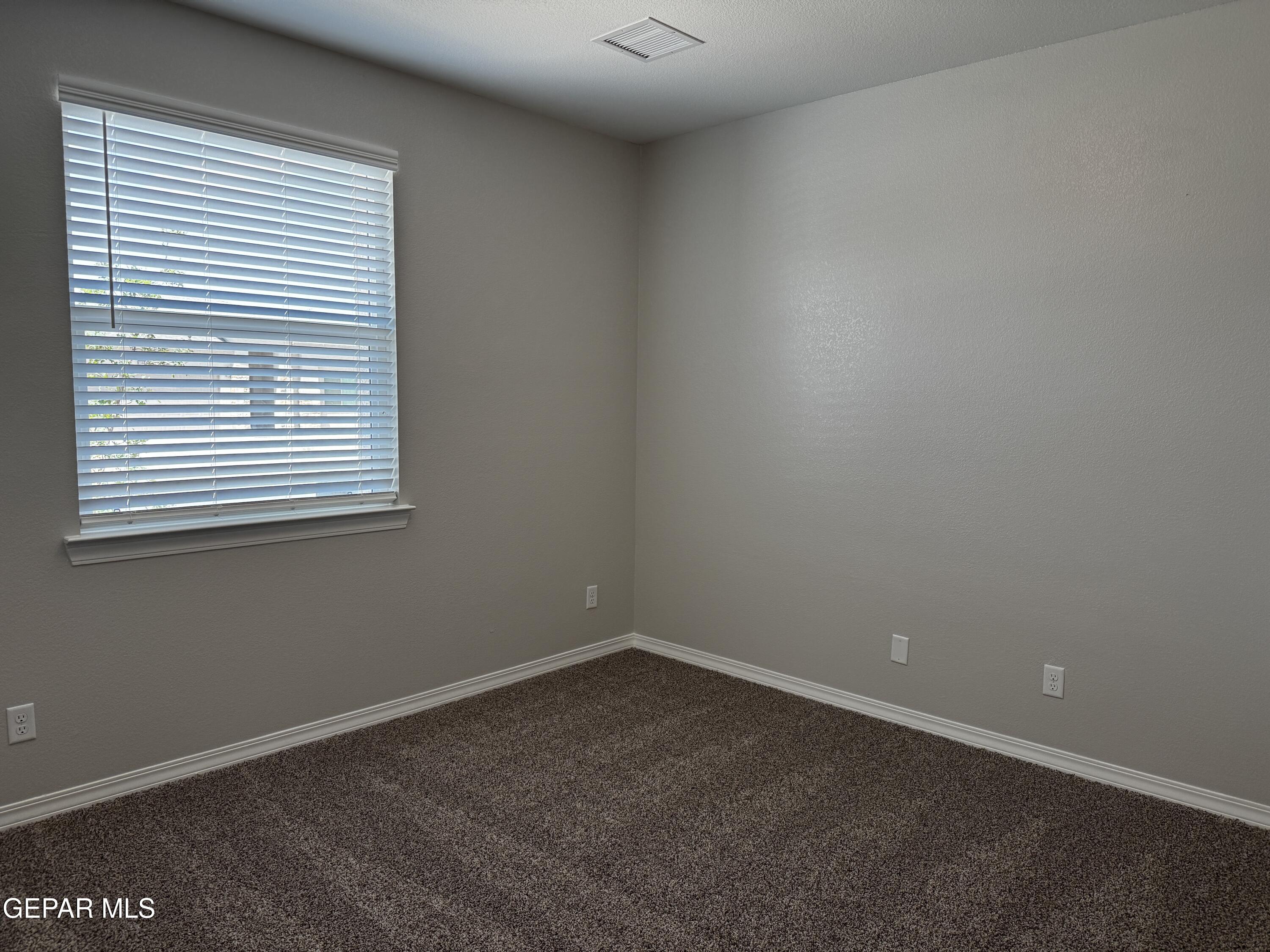 14434 Aria Lopez Drive El Paso, TX 79938 - Photo 15 of 37 an empty room with a window