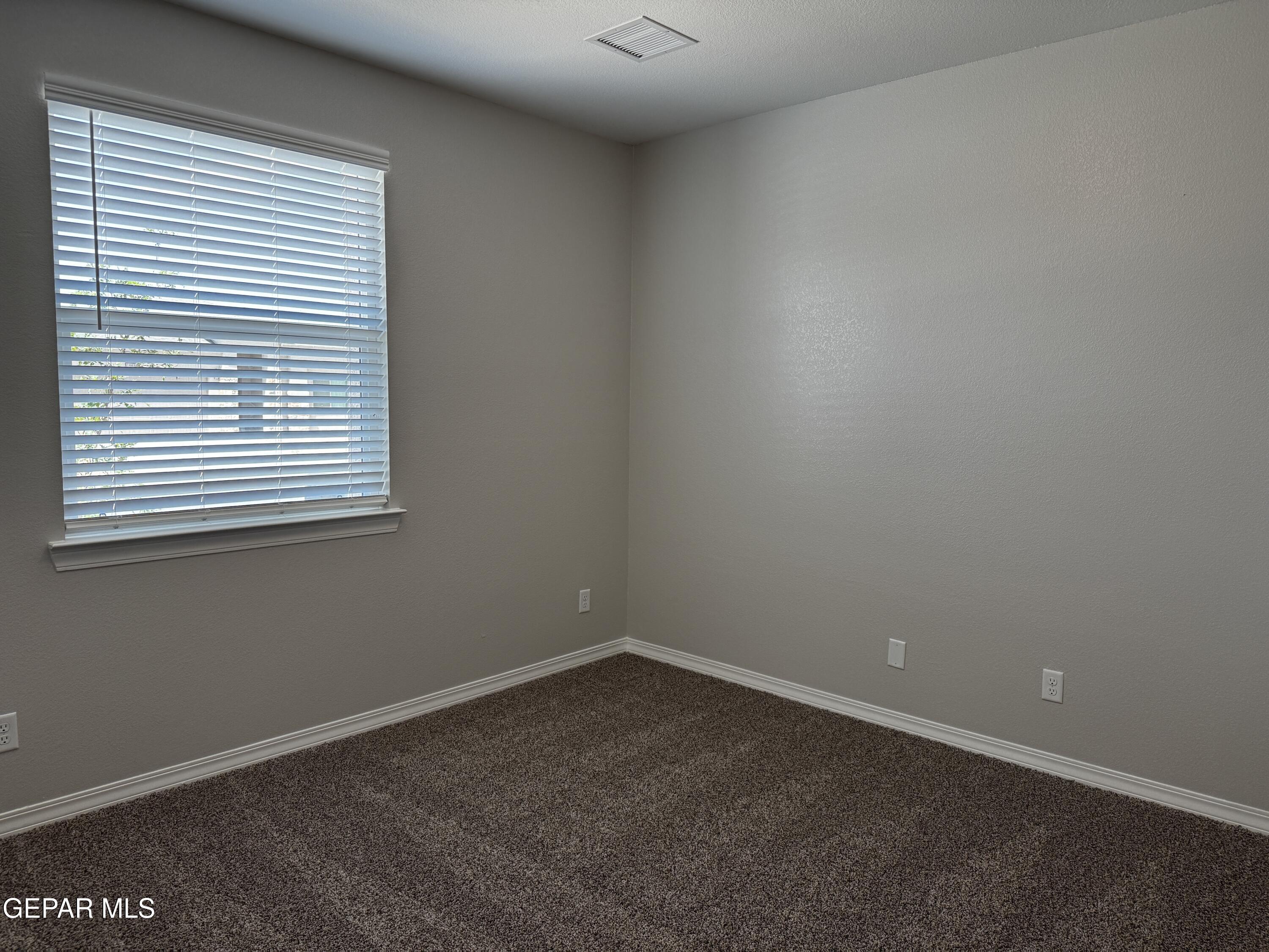 14434 Aria Lopez Drive El Paso, TX 79938 - Photo 16 of 37 an empty room with a window