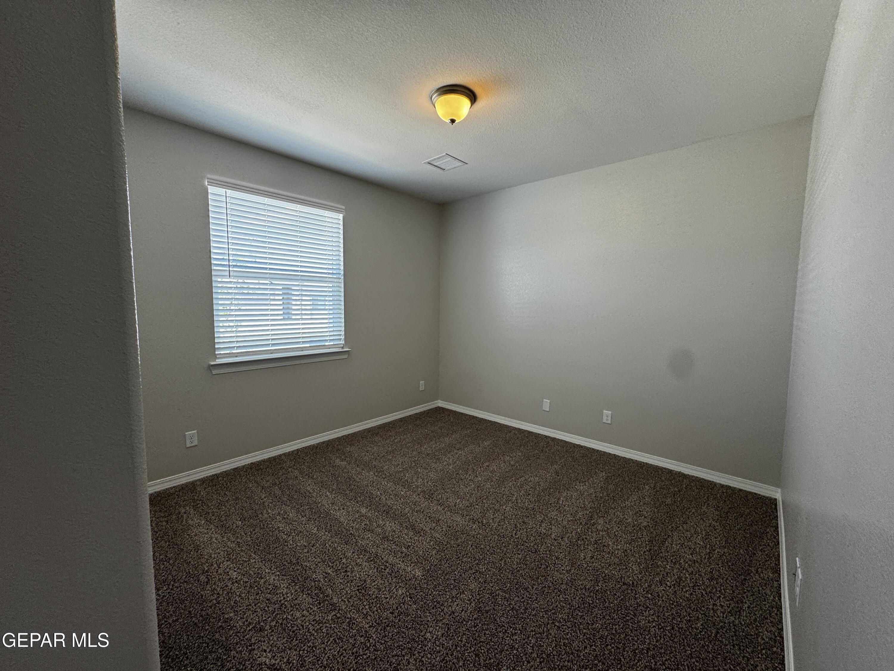 14434 Aria Lopez Drive El Paso, TX 79938 - Photo 17 of 37 an empty room with a window