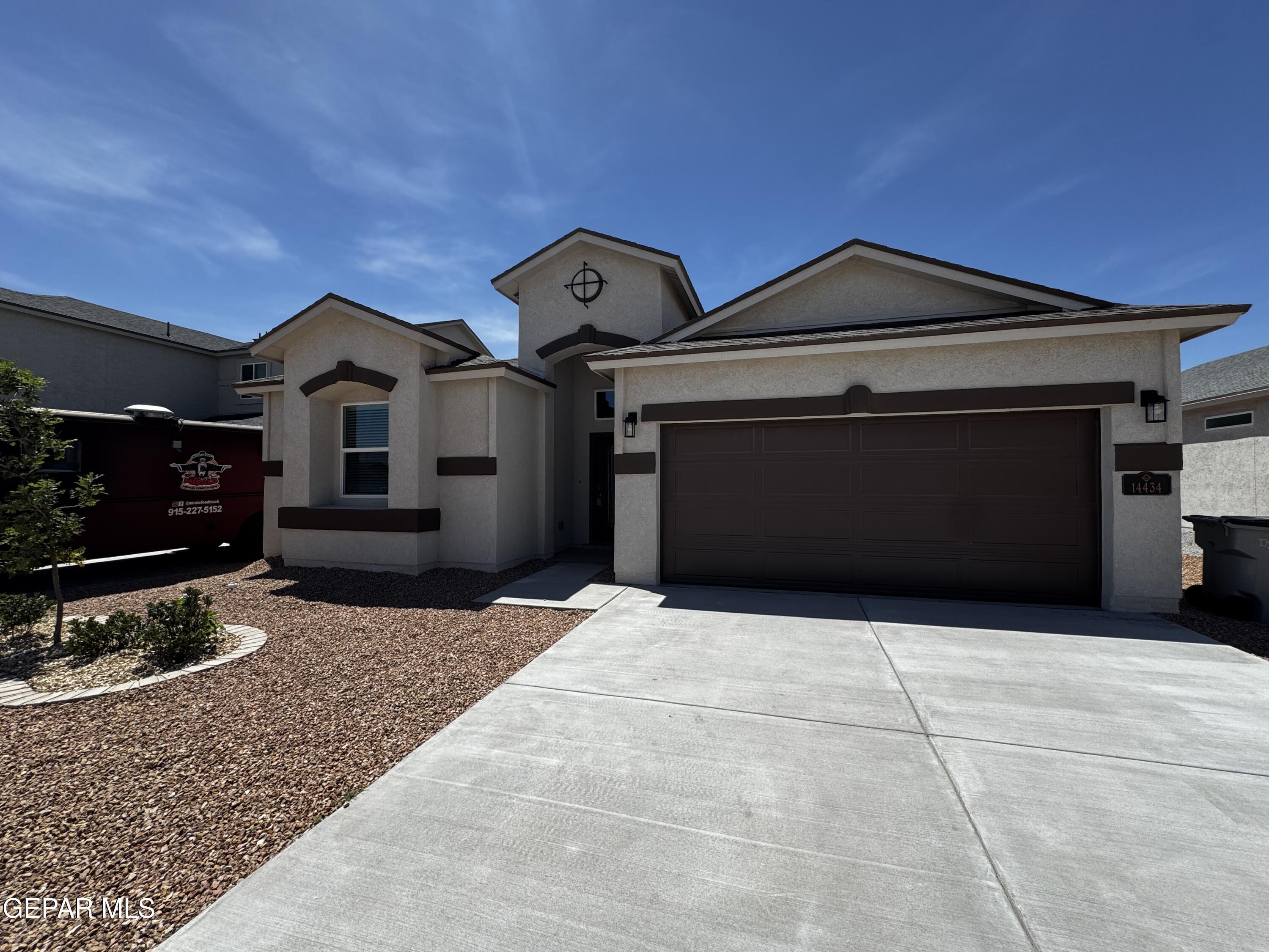 14434 Aria Lopez Drive El Paso, TX 79938 - Photo 2 of 37 a front view of a house with yard