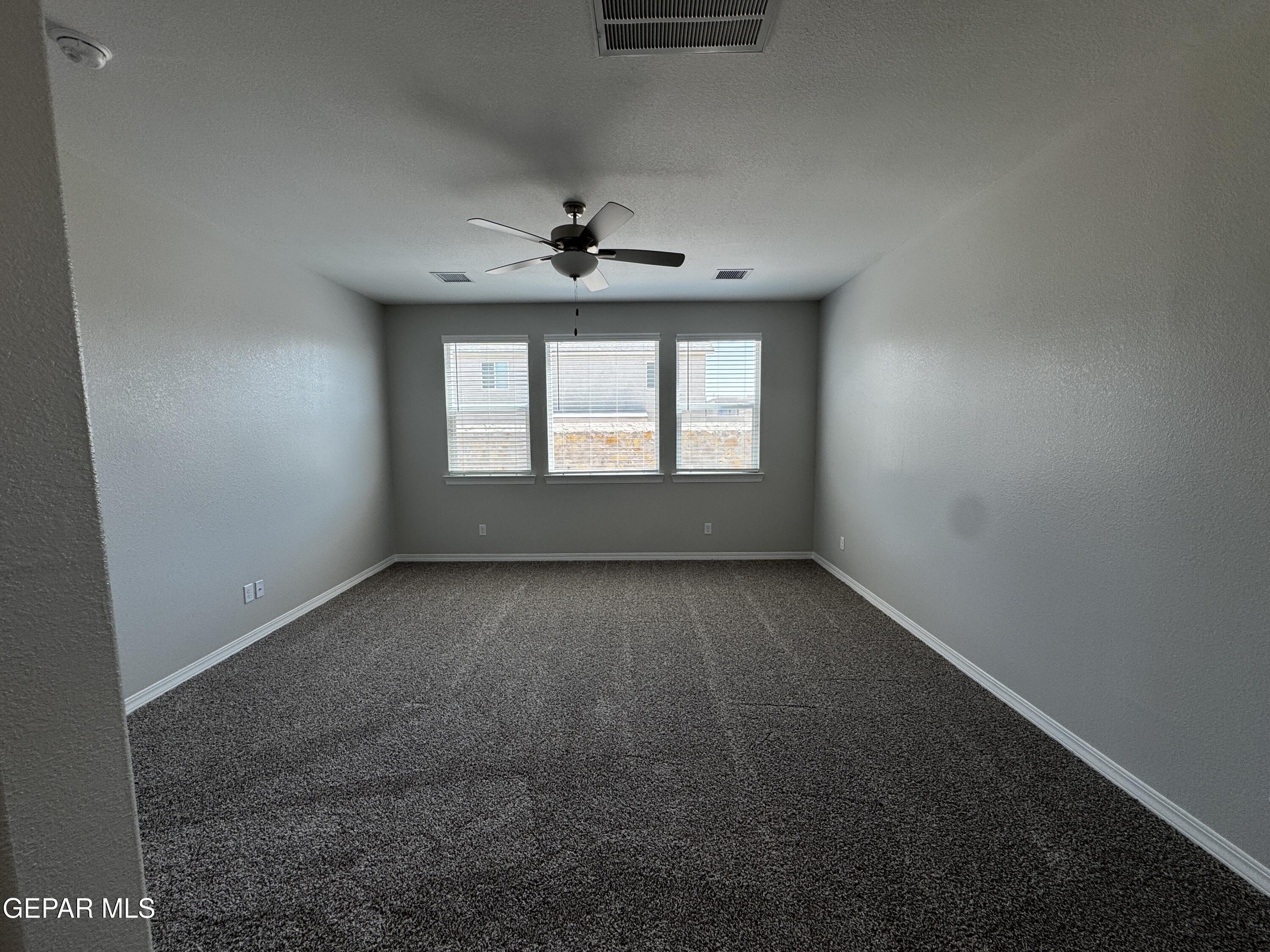 14434 Aria Lopez Drive El Paso, TX 79938 - Photo 24 of 37 an empty room with a window and a hallway