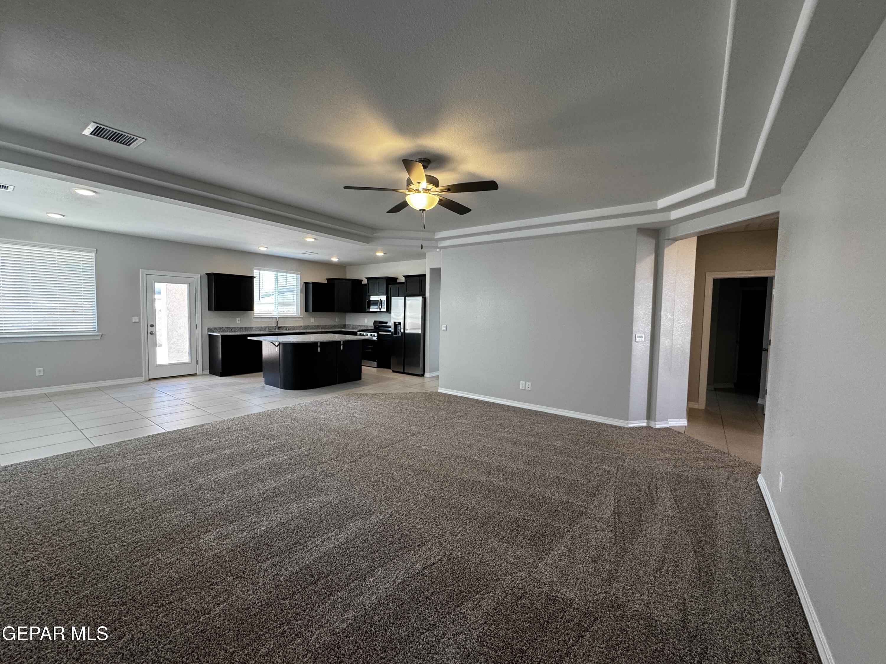 14434 Aria Lopez Drive El Paso, TX 79938 - Photo 4 of 37 a view of a livingroom with a flat screen tv