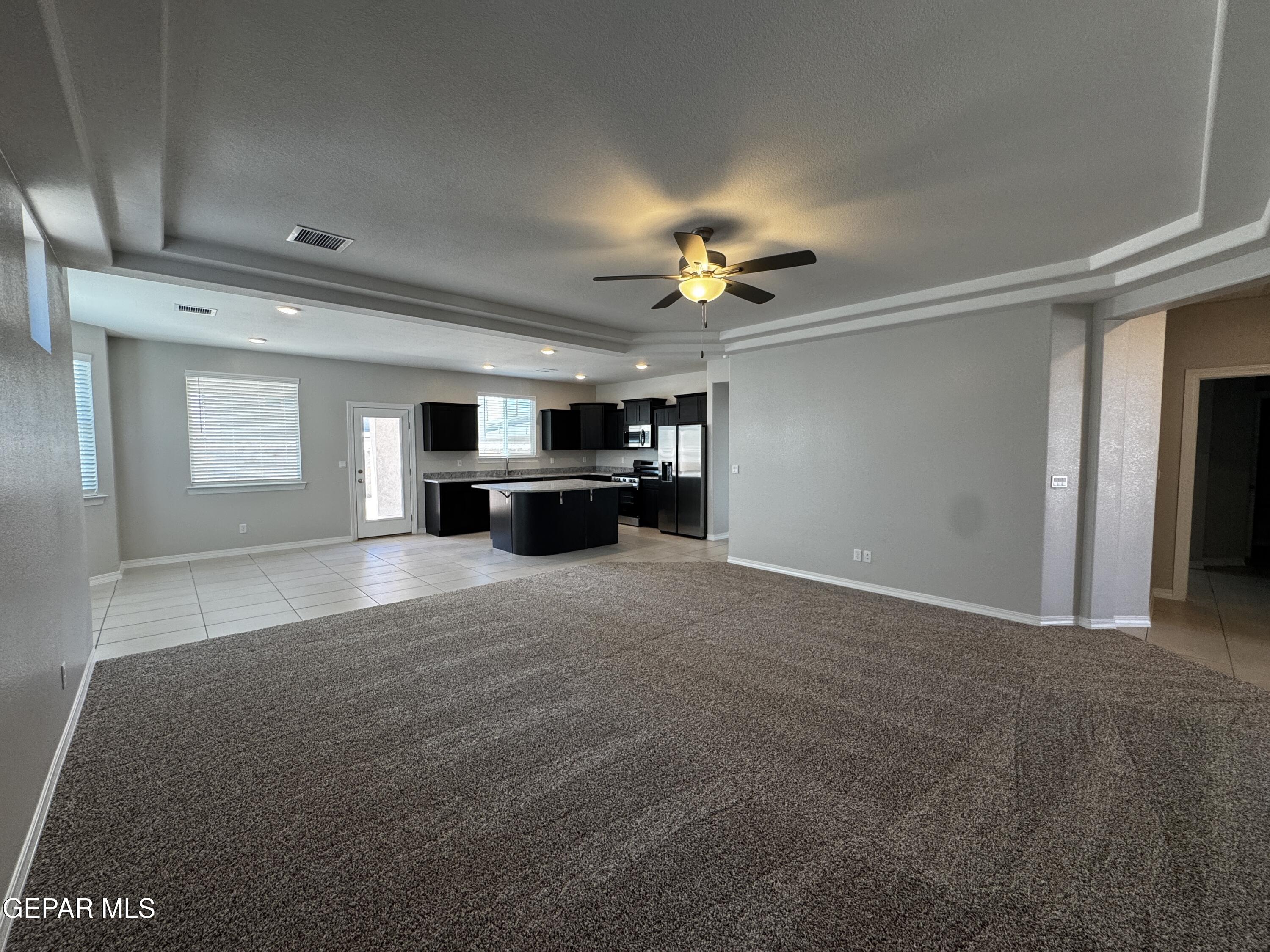 14434 Aria Lopez Drive El Paso, TX 79938 - Photo 5 of 37 a view of empty room with a kitchen