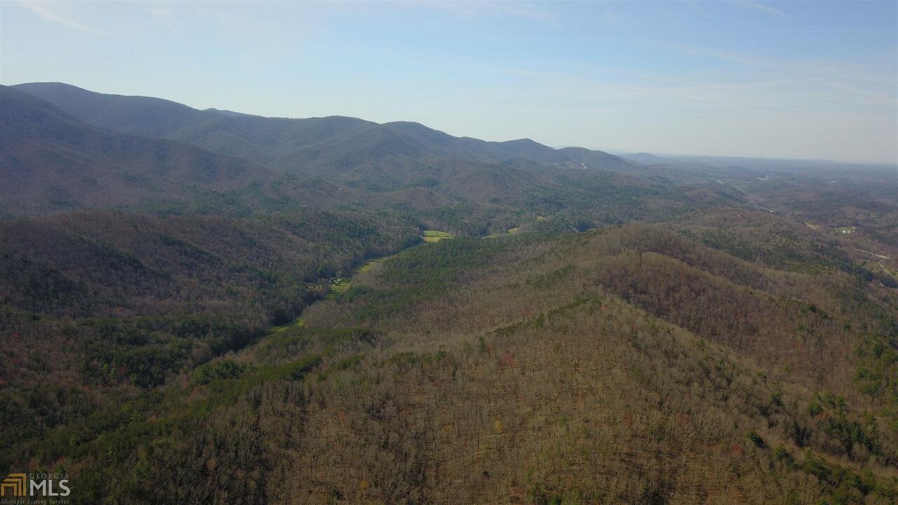 0 Laurel Creek Trail, Unit 25 Blue Ridge, GA 30513 - Photo 1 of 1 a view of a dry yard with mountains in the background